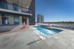 a swimming pool on the side of a building at The Laundry Rooms - Waterloo in Waterloo