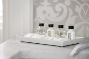 four bottles of medicine sitting on a white tray at Hamilton Turner Inn in Savannah