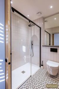 a bathroom with a shower and a toilet at Station Cottage in North Berwick