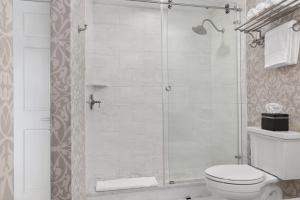 a bathroom with a shower with a toilet at Hamilton Turner Inn in Savannah