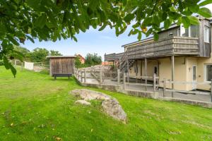 a park with a building and a grass field at Cozy Holiday Apartment In Allinge in Allinge