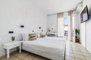 Postel nebo postele na pokoji v ubytování Aperitton Hotel