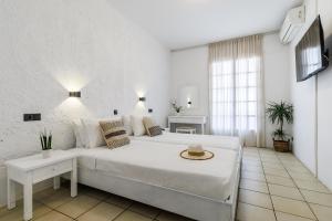 Postel nebo postele na pokoji v ubytování Aperitton Hotel