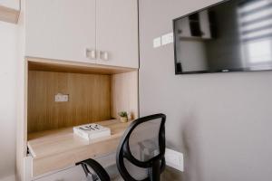 TV a/nebo společenská místnost v ubytování LA88 Bayview Rooms