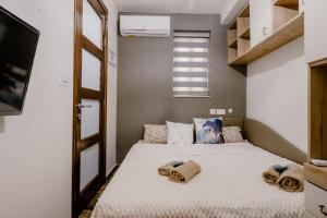 Postel nebo postele na pokoji v ubytování LA88 Bayview Rooms