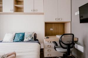 TV a/nebo společenská místnost v ubytování LA88 Bayview Rooms