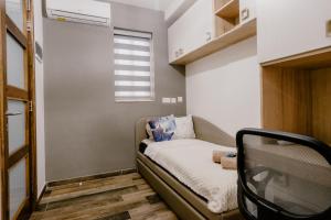 Postel nebo postele na pokoji v ubytování LA88 Bayview Rooms