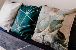 Postel nebo postele na pokoji v ubytování LA88 Bayview Rooms