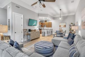 a living room with a couch and a table at Le Jardin 168 - 3BR 3.5BA - (10) in Destin