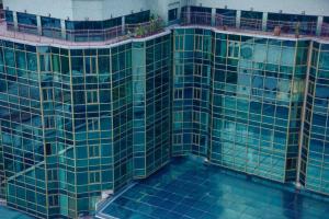 an overhead view of a building with a swimming pool at Harbour View Suites in Dar es Salaam