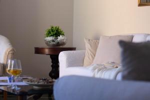 a cat sitting on a couch in a living room at Daisy by PortofinoHomes in Santa Margherita Ligure