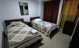 Krevet ili kreveti u jedinici u okviru objekta Hotel Tarento Suite