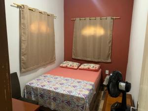 Giường trong phòng chung tại Apto Florescer - No Espaço Florescer