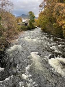 a river with rapids on top of it at One Bedroom Apartment in Bethesda in Bangor