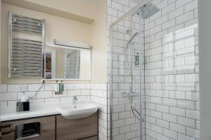 a bathroom with a sink and a shower at The Tynemouth Castle Inn - The Inn Collection Group in Tynemouth