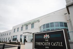 a building with a sign in front of it at The Tynemouth Castle Inn - The Inn Collection Group in Tynemouth