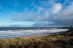 a view of the ocean from a beach at The Tynemouth Castle Inn - The Inn Collection Group in Tynemouth