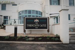 a sign in front of a building at The Tynemouth Castle Inn - The Inn Collection Group in Tynemouth