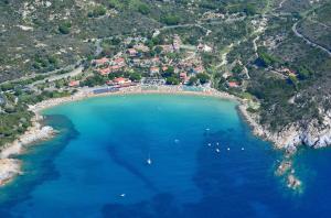 an aerial view of a beach with boats in the water at Hotel Baia Imperiale in Campo nell'Elba