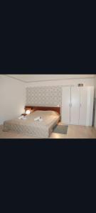 a bedroom with a bed and white cabinets at FREE GARAGE! Downtown apartment, near to Andrássy avenue in Budapest