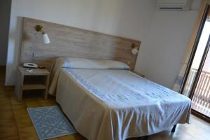 Postel nebo postele na pokoji v ubytování Hotel Citti