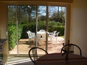 a view of a patio with a table and chairs at Lanes in Montgaillard