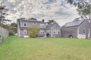 a large house with a yard in front of it at 1 Mi to Windmill Beach South Yarmouth Apt! in Yarmouth