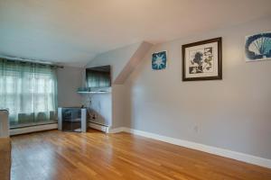 an empty living room with a hard wood floor at 1 Mi to Windmill Beach South Yarmouth Apt! in Yarmouth