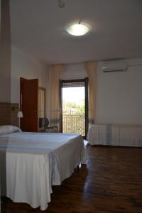 Postel nebo postele na pokoji v ubytování Hotel Citti
