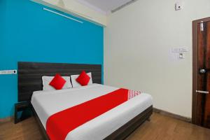 Posteľ alebo postele v izbe v ubytovaní POP 81014 Abhi Square
