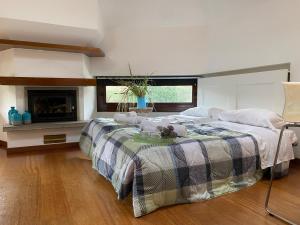 a bedroom with two beds and a fireplace at il camino felice - 201 Autodromo F1 & Villa Reale in Monza
