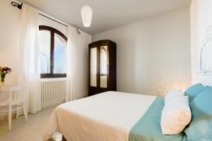 Voodi või voodid majutusasutuse B&B Sa Cruxitta toas