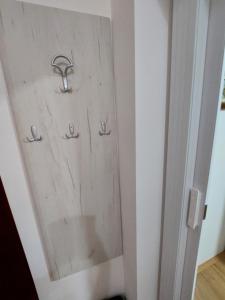 a door in a room with two handles on it at DAN 9 in Sombor