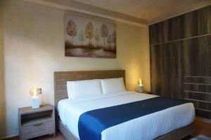 Postel nebo postele na pokoji v ubytování Hotel Pietro Santo
