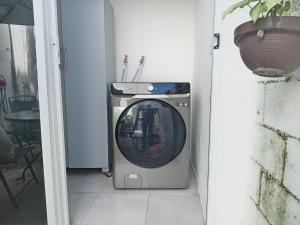 a washing machine is sitting in a room at Casa Narcisa Studio Apartaments in Mérida