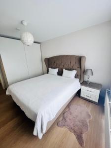 Кровать или кровати в номере Windsor Residence Grimbergen