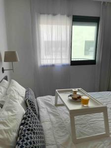 Postel nebo postele na pokoji v ubytování Central Holiday Apartment