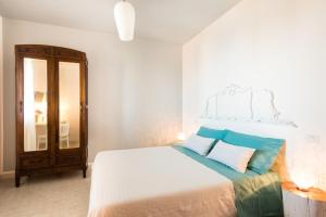 Ένα ή περισσότερα κρεβάτια σε δωμάτιο στο B&B Sa Cruxitta