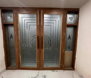 a pair of glass doors in a building at Hotel Royal Palace Gaya in Gaya