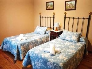 Postel nebo postele na pokoji v ubytování Casa Pelayo 2