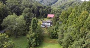 an aerial view of a house in the middle of a forest at Historic Seaton Springs Farm B&B - M Seaton Queen Room with Private Bath down the hall in Sevierville