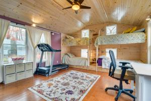 a bedroom with two bunk beds and a desk at Waterfront Lake Webb Cabin Rental with Dock and Views! 