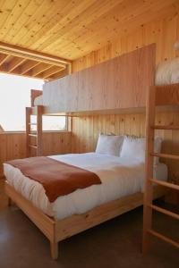 a bedroom with two bunk beds in a cabin at Alpine House #1 in Steamboat Springs