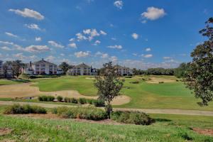 a view of a golf course with houses at New In The Market 3bd Apartment With Wide View! in Kissimmee