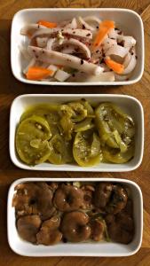 three dishes of food with vegetables in them on a table at Home-restaurant in Vanadzor in Vanadzor