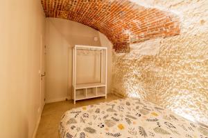 Posteľ alebo postele v izbe v ubytovaní Gîte troglodyte - Troglo du Pontcher