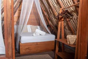 Letto o letti in una camera di Mapache Hostel & Camping