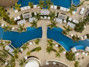 an aerial view of a resort with palm trees and a pool at Hyatt Ziva Cap Cana in Punta Cana