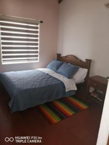 Un pat sau paturi într-o cameră la Casa Donde Gomez