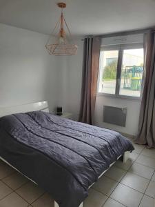 Postel nebo postele na pokoji v ubytování Appartement camon